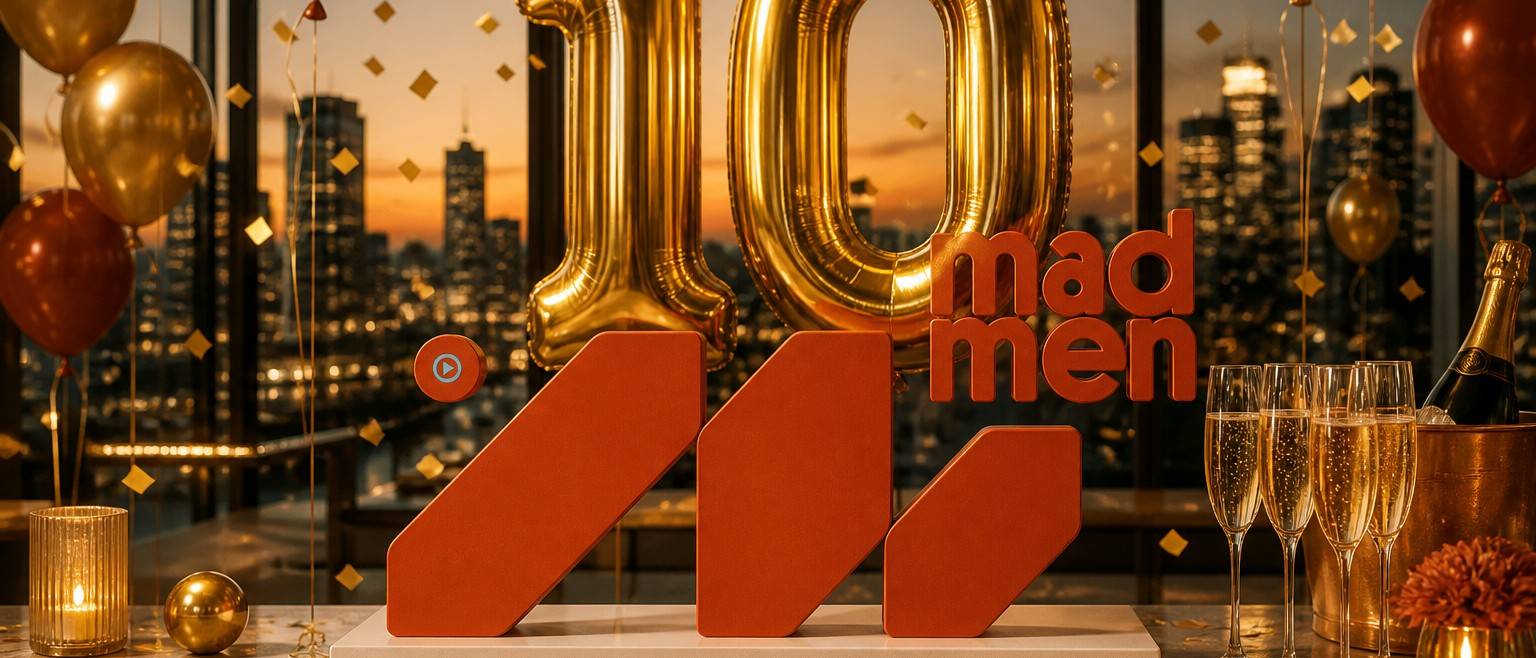 MadMen logo with gold 10 balloons and confetti at the company’s 10-year anniversary celebration